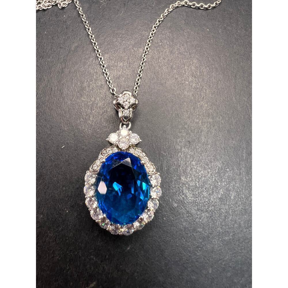Blue and white CZ sterling silver halo pendant